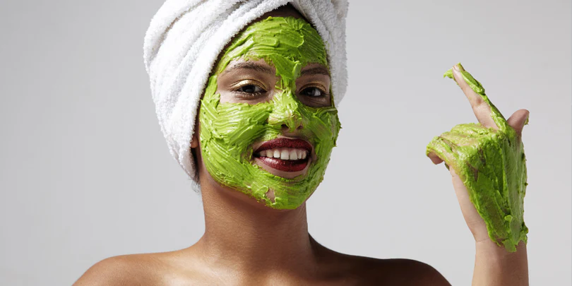 Woman holding Shaheencosmetics products confidently in front of mirror representing your skin your rules philosophy