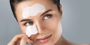 Pore strip being removed from nose with question marks and science icons representing debunked skincare myths